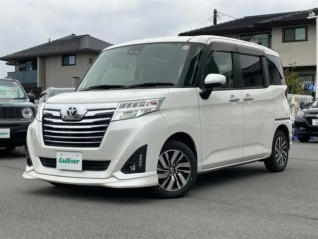 トヨタ ルーミー カスタムG 静岡県 2020(令2)年 4.5万km パールホワイトⅢ エンジンスタートボタン/スマートキー/スペアキー１本/パワーステアリング/パワーウィンドウ/オートエアコン/オートライト/オートマチックハイビーム/LEDヘッドライト/クルーズコントロール有/純正ETC2.0/純正フロアマット/純正アルミホイール/純正SDナビ（CD、DVD、BT、フルセグ）/コーナーセンサー前後/全方位カメラ/横滑り防止装置/衝突軽減システム/Wエアバック/D+N席シートヒーター/両側パワースライドドア/アイドリングスストップ/取扱説明書