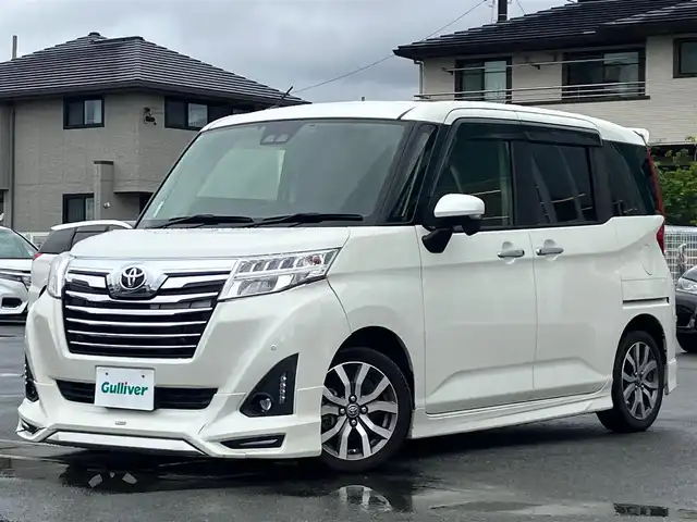 トヨタ ルーミー カスタムG－T 静岡県 2019(平31)年 7.4万km パールホワイトⅢ アルパイン9インチディスプレイオーディオ/モデリスタエアロ（F.S.R）/バックカメラ/ドライブレコーダー/ETC/デジタルインナーミラー/エンジンスタートボタン/パワーステアリング/パワーウィンドウ/アイドリングストップ/スマートキー/スペアキー1本/オートエアコン/クルーズコントロール/USB入力端子/純正フロアマット/D席N席シートヒーター/両側パワースライドドア/純正アルミホイール/ABS/横滑り防止装置/コーナーセンサー前後/レーンキープアシスト/オートライト/オートマチックハイビーム/LEDヘッドライト/Wエアバック/衝突軽減システム/デジタルインナーミラー