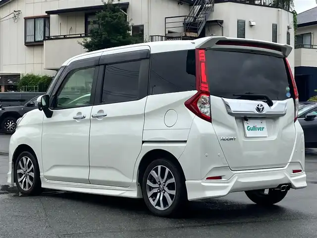 トヨタ ルーミー カスタムG－T 静岡県 2019(平31)年 7.4万km パールホワイトⅢ アルパイン9インチディスプレイオーディオ/モデリスタエアロ（F.S.R）/バックカメラ/ドライブレコーダー/ETC/デジタルインナーミラー/エンジンスタートボタン/パワーステアリング/パワーウィンドウ/アイドリングストップ/スマートキー/スペアキー1本/オートエアコン/クルーズコントロール/USB入力端子/純正フロアマット/D席N席シートヒーター/両側パワースライドドア/純正アルミホイール/ABS/横滑り防止装置/コーナーセンサー前後/レーンキープアシスト/オートライト/オートマチックハイビーム/LEDヘッドライト/Wエアバック/衝突軽減システム/デジタルインナーミラー