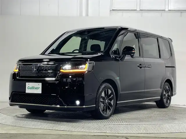 ホンダ ステップワゴン スパーダ eHEV 大阪府 2025(令7)年 0.1千km クリスタルブラックパール 11.4インチナビ　バックカメラ　Bluetooth　フルセグTV DVD再生　ホンダセンシング　レーダークルーズコントロール　電動リアゲート　両側パワースライドドア　シートヒーター　BSM オートライト　LEDヘッドライト　スマートキー2本