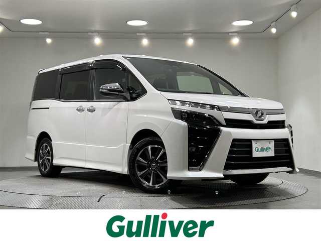 トヨタ ヴォクシー ZS 煌 愛知県 2018(平30)年 5.9万km ホワイトパールクリスタルシャイン 純正９インチナビ　/Bluetooth/CD/DVD/フリップダウンモニター　/両側パワースライドドア　/ビルトインＥＴＣ/オートクルーズコントロール　/ダブルエアコン　/MTモード付AT/衝突被害軽減システム　/レーンキープアシスト　/横滑り防止システム/アイドリングストップ/オートLEDヘッドライト/オートマチックハイビーム/純正フロアマット