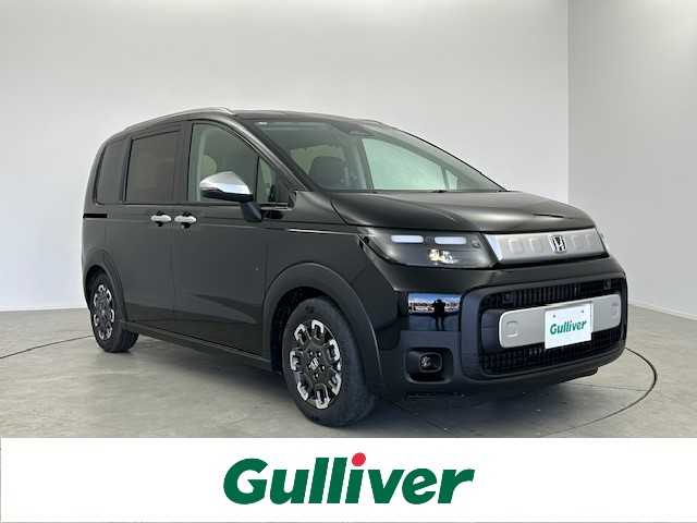 ホンダ フリード クロスター 愛知県 2025(令7)年 0.1万km未満 クリスタルブラックパール 純正9インチナビ　/（フルセグ／Bluetooth）　/レーダークルーズコントロール　/バックモニター　/コーナーセンサー　/衝突軽減システム　/レーンキープアシスト　/ブラインドスポットモニター　/両側パワースライドドア　/ハーフレザーシート（ブラック）　/前席シートヒーター　/純正AW　