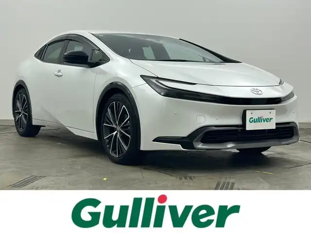 トヨタ プリウス Z 岡山県 2023(令5)年 1.6万km プラチナホワイトパールマイカ 純正12.3インチディスプレイオーディオ	/【ナビ/フルセグ/Bluetooth/Carplay】	/パノラミックビューモニター/追従型クルーズコントロール	/オートハイビーム	/LEDヘッドライト（AUTO機能付き）	/ビルトインETC2.0	/前席シートヒーター	/前席エアシート/ステアリングヒーター/運転席パワーシート	/パワーバックドア/衝突軽減ブレーキシステム	/車線逸脱防止システム	/横滑り防止装置	/踏み間違い防止/ブラインドスポットモニター/ISOFIX/純正19インチアルミ	/コーナーセンサー（前後）	/純正フロアマット	/ステアリングスイッチ/プッシュスタート	/チルトステアリング/シートリフター/ウィンカーミラー/ドアバイザー