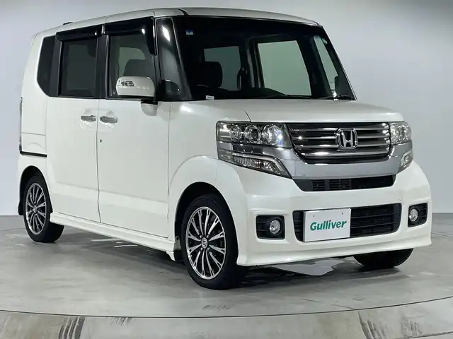 ホンダ Ｎ ＢＯＸ カスタム G ターボパッケージ 福岡県 2013(平25)年 7万km プレミアムホワイトパール ナビ（BT/フルセグ/CDDVD/AMFM）/両側パワースライド/パドルシフト（MT付きAT）/ステアリングスイッチ/衝突被害軽減システム/横滑り防止装置/盗難防止装置/アルミホイール/ETC/クルーズコントロール/スマートキー/エンジンボタン