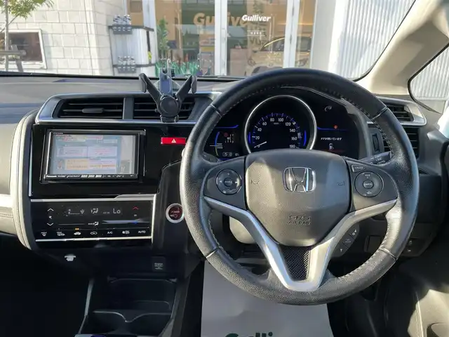 ホンダ フィット ハイブリット Lパッケージ 石川県 2016(平28)年 9.7万km 青 社外メモリーナビ/社外CD/DVD/フルセグTV/バックカメラ/ETC/スマートキー/プッシュスタート/電動ミラー/クルーズコントロール/ハーフレザーシート