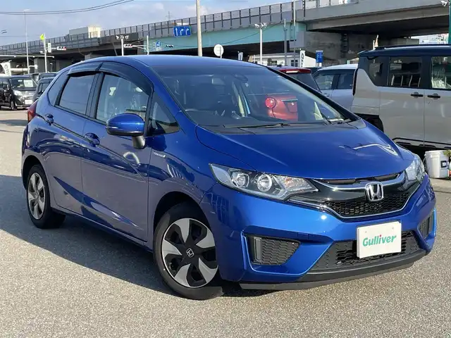ホンダ フィット ハイブリット Lパッケージ 石川県 2016(平28)年 9.7万km 青 社外メモリーナビ/社外CD/DVD/フルセグTV/バックカメラ/ETC/スマートキー/プッシュスタート/電動ミラー/クルーズコントロール/ハーフレザーシート
