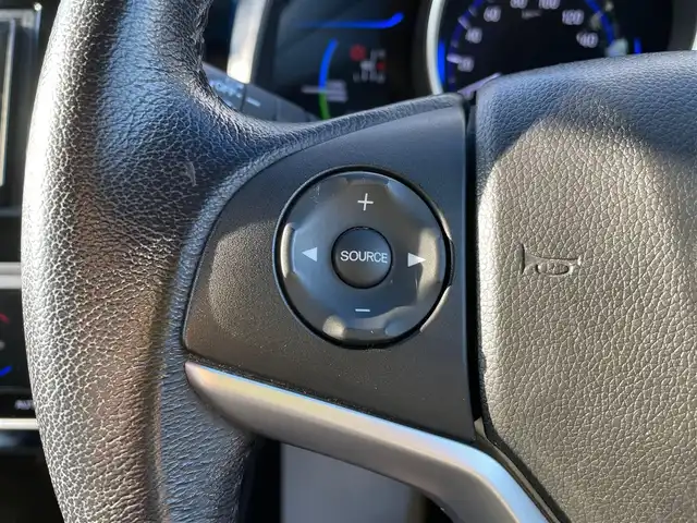 ホンダ フィット ハイブリット Lパッケージ 石川県 2016(平28)年 9.7万km 青 社外メモリーナビ/社外CD/DVD/フルセグTV/バックカメラ/ETC/スマートキー/プッシュスタート/電動ミラー/クルーズコントロール/ハーフレザーシート