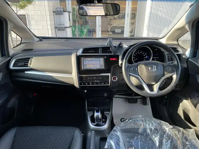 ホンダ フィット ハイブリット Lパッケージ 石川県 2016(平28)年 9.7万km 青 社外メモリーナビ/社外CD/DVD/フルセグTV/バックカメラ/ETC/スマートキー/プッシュスタート/電動ミラー/クルーズコントロール/ハーフレザーシート