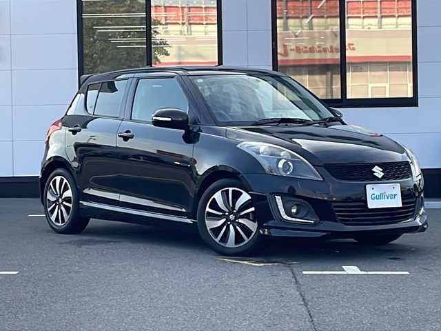 スズキ スイフト RS－DJE 山口県 2015(平27)年 6.2万km スーパーブラックパール ワンオーナー/純正SDナビ　【CN-R302Z】/・Bluetooth接続/・AM/FM/・DVD再生機能有/・ワンセグTV/ビルトインETC/クルーズコントロール/パドルシフト/アイドリングストップ/横滑り防止装置/純正フロアマット/スマートキー/プッシュスタート/スペアキー1本/USB入力端子/純正16インチアルミホイール/ウィンカーミラー