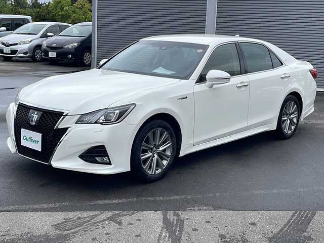 トヨタ クラウン ハイブリッド 青森県 2018(平30)年 7.2万km ホワイトパールクリスタルシャイン ・インテリジェントクリアランスソナー/・カーテンエアバック/・ABS/・純正ナビ（ブルーレイ再生機能付き）/・社外カメラ（バック）/・電動リアゲート/・クルーズコントロール（追従走行有）/・パワーシート（D+N席）/・メモリ機能付きパワーシート（D席）/・エコドライブモード/・純正AW/・スマートキー/・ETC2.0