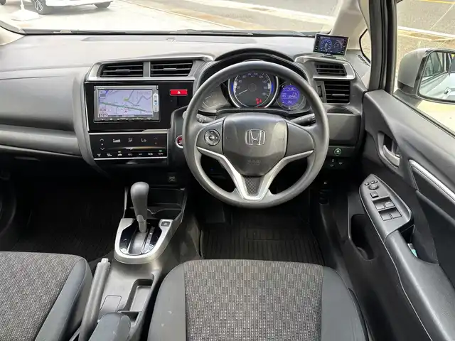 ホンダ フィット 13G Lパッケージ 京都府 2013(平25)年 6.6万km アラバスターシルバーメタリック ワンオーナー/禁煙車/65856キロ/純正ナビ/ワンセグTV/Bluetooth/ETC/バックカメラ/LEDヘットライト/スマートキー２個/保証書/説明書
