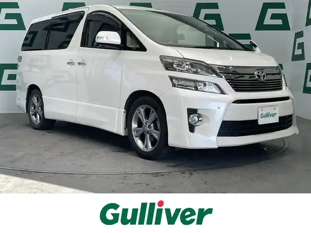 トヨタ ヴェルファイア 2．4Z 鹿児島県 2013(平25)年 13.6万km ホワイトパールクリスタルシャイン 禁煙車/フリップダウンモニター/両側パワースライドドア/サンルーフ/社外SDナビ(AVIC-R2802)/　・Bluetooth/　・CD/DVD/　・フルセグTV/　・AUX/　・AM/FM/　・USB/バックカメラ/ETC/スマホホルダー/コーナーセンサー/純正フロアマット/純正アルミホイール/ステアリングリモコン/電動格納ミラー/オートライト/プッシュスタート