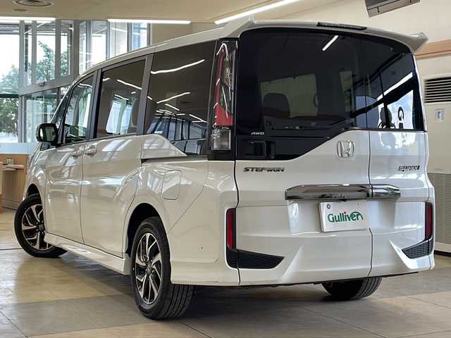 ホンダ ステップワゴン スパーダ クルスピセンシング 道央・札幌 2021(令3)年 5.7万km プラチナホワイトパール ・ワンオーナー/・4WD/・純正9インチナビ/・フルセグTV/DVD/CD/SD/BT/・バックカメラ/・両側パワースライドドア/・ホンダセンシング/・CMBS/・アダプティブクルーズコントロール/・先行車発進お知らせ/・路外逸脱抑制システム/・レーンキープアシスト/・標識認識機能/・パドルシフト/・横滑り防止/・ワイパーデアイサー/・ビルトインETC/・ハーフレザーシート/・前席シートヒーター/・LEDヘッドライト/・LEDフォグ/・アイドリングストップ/・プッシュスタート/・スマートキー/・電格ミラー/・ミラーヒーター