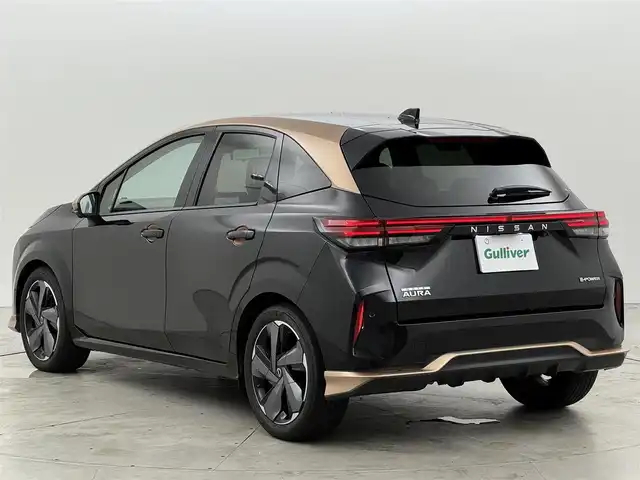 日産 オーラ G レザーエディション 福岡県 2021(令3)年 2.9万km ミッドナイトブラック/サンライズカッパー 純正９型ナビ　/全方位カメラ　/ＢＯＳＥサウンド　/デジタルルームミラー　/ワイヤレス充電　/プロパイロット　/コーナーセンサー/エマージェンシーブレーキ　/レーンキープ　/ＢＳＭ　/シートヒーター　/ステアリングヒーター　/ＬＥＤ