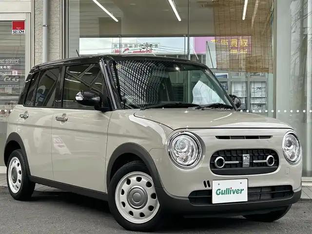 スズキ ラパン ＬＣ X 高知県 2023(令5)年 0.9万km フォーンベージュメタリック/アーバンブラウン 2トーン 社外ナビ/・フルセグTV/・Bluetoothオーディオ/スズキセーフティーサポート/・衝突被害軽減システム/・車線逸脱防止支援システム/・横滑り防止装置/シートヒーター/純正ETC/LEDヘッドライト/オートマチックハイビーム/コーナーセンサー/スペアキー×１/プッシュスタート