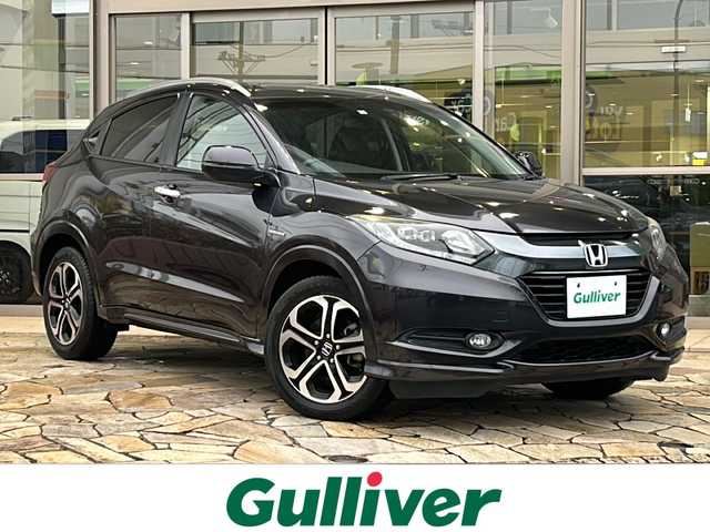 ホンダ ヴェゼル ハイブリッド 静岡県 2016(平28)年 4万km ルーセブラックM 純正ナビ/・CD/DVD/Bluetooth/USB/HDMI/・フルセグTV/ラジオ/主要装備/・バックカメラ　/・ＥＴＣ　/・シートヒーター　/・ハーフレザーシート　/・クルーズコントロール　/・ドライブレコーダー　/・パドルシフト　/・レーンキープアシスト　/・ルーフレール　/・衝突軽減ブレーキ　/・ＬＥＤヘッドライト/・寒冷地仕様/・ステアリングリモコン/・フォグランプ/・オートライト/・プッシュスタート/・スマートキー/・ヒーテッドドアミラー