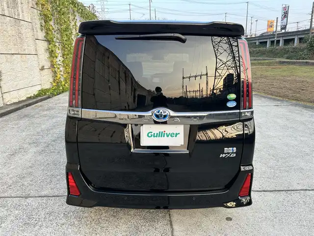 トヨタ ノア ハイブリッド Si ダブルバイビーⅢ 長崎県 2021(令3)年 7.3万km ブラック ワンオーナー/純正9インチナビ/（CD/DVD/BT/フルセグ）/バックカメラ/フリップダウンモニター/衝突軽減システム/レーンアシスト/両側パワースライドドア/クルーズコントロール/ビルトインETC/前席シートヒーター/オートライト/純正16インチAW