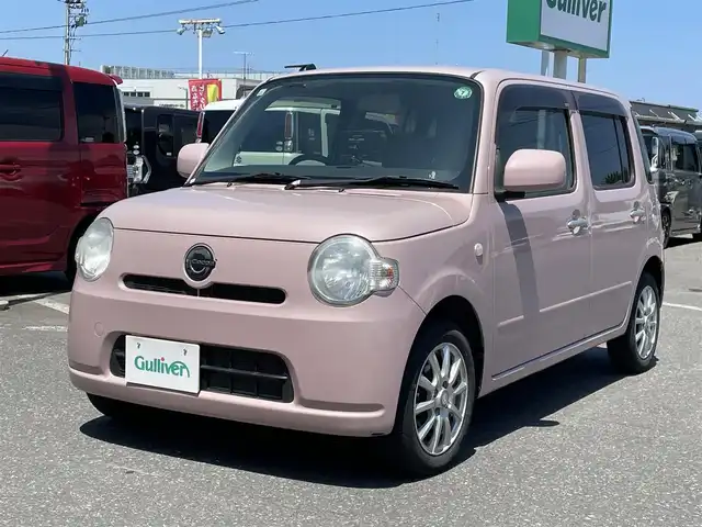 ダイハツ ミラ ココア L 青森県 2015(平27)年 5万km ムースピンクパール ・純正CD/・社外ポータブルナビ/・ワンセグTV/・アイドリングストップ/・電格ドアミラー/・社外１４インチアルミホイール/・純正フロアマット/・ドアバイザー/・新車時保証書/・取扱説明書