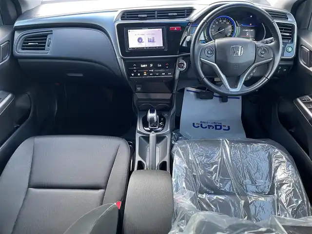 ホンダ グレイス ハイブリッド LX 沖縄県 2015(平27)年 5.5万km クリスタルブラックパール (株)IDOMが運営する【じしゃロンコザ店】の自社ローン専用車両になりますこちらは現金またはオートローンご利用時の価格です。自社ローンご希望の方は別途その旨お申付け下さい/純正ナビ　/Bluetooth接続　/ETC　/クルーズコントロール　/衝突被害軽減ブレーキ　/プッシュスタート　/スマートキー　/スペアキー　/オートライト