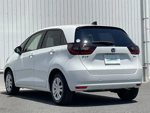 ホンダ フィット e:HEVホーム 群馬県 2024(令6)年 0.2万km プラチナホワイトパール ホンダセンシング/・衝突軽減ブレーキ/・パーキングセンサー警報/・踏み間違い防止/・路外逸脱抑制/純正9インチSDナビ　VXU-245FTi/　(CD DVD Bluetooth SD フルセグ　AM FM）/バックカメラ/LEDヘッドライト/オートライト/クルーズコントロール/USB/純正フロアマット