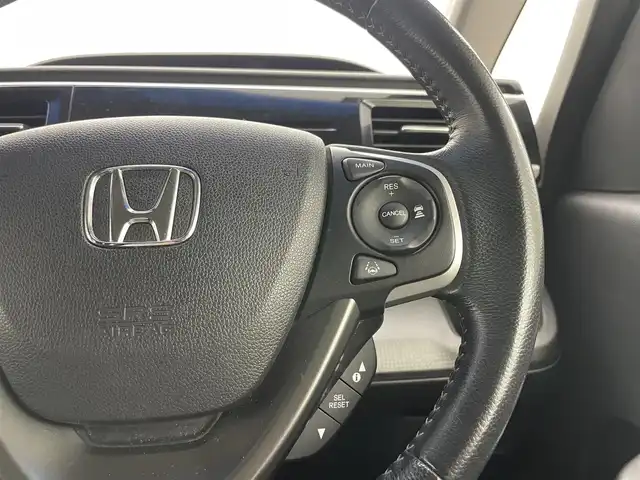 ホンダ ステップワゴン スパーダ ホンダセンシング 岡山県 2016(平28)年 4.8万km ホワイトオーキッドパール 純正9インチナビ　VXM-175VFNi/地デジTV/Bluetooth/DVD/CD/AUX/USB/バックカメラ /フリップダウンモニター/両側パワースライドドア/ビルトインETC/ホンダセンシング /アダプティブクルーズコントロール/LEDヘッドライト/前後ドライブレコーダー/オートライト /レーンキープアシスト/プッシュスタート /スマートキー/純正フロアマット /純正16インチアルミホイール/ミラーヒーター
