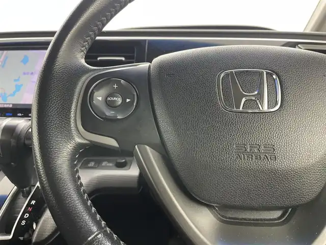 ホンダ ステップワゴン スパーダ ホンダセンシング 岡山県 2016(平28)年 4.8万km ホワイトオーキッドパール 純正9インチナビ　VXM-175VFNi/地デジTV/Bluetooth/DVD/CD/AUX/USB/バックカメラ /フリップダウンモニター/両側パワースライドドア/ビルトインETC/ホンダセンシング /アダプティブクルーズコントロール/LEDヘッドライト/前後ドライブレコーダー/オートライト /レーンキープアシスト/プッシュスタート /スマートキー/純正フロアマット /純正16インチアルミホイール/ミラーヒーター
