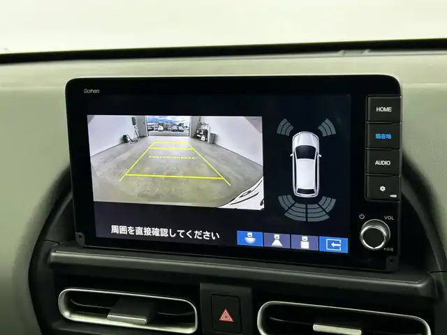 ホンダ フリード ハイブリット e:HEV クロスター 大分県 2025(令7)年 0.1千km ベージュ 純正9インチナビ（LXM-242ZFNI）/Bluetooth/フルセグ/Applecarplay/ホンダセンシング/・衝突被害軽減ブレーキ/・アダプティブクルーズコントロール/・車線維持支援システム/・誤発進抑制機能/・後方誤発進抑制機能/レーダークルコン/バックカメラ/コーナーセンサー/オートライト/オートホールドブレーキ/リアクーラー/シートヒーター/ステアリングスイッチ/革巻ステアリング/フォグランプ