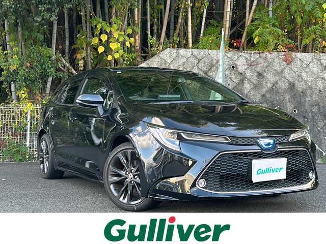 トヨタ カローラツーリング ハイブリッド ダブルバイビー 京都府 2021(令3)年 8.1万km ブラックマイカ 純正ディスプレイオーディオ/・フルセグTV/BT Audio/AM/FM/USB/・バックカメラ/前後ドラレコ/ビルトインETC/プリクラッシュセーフティ/レーダークルコン/車線逸脱防止/オートライト/オートハイビーム/オールオートパワーウィンドウ/電格ウィンカーミラー/電動パーキングブレーキ/プッシュスタート/ハーフレザーシート/横滑り防止機能/コーナーセンサー/EVMODE/DRIVEMODE/純正ドアバイザー/純正フロアマット/保証書/取扱説明書/スマートキースペア×１