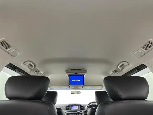 日産 エルグランド 250HWS アーバンクロム 岡山県 2012(平24)年 7.4万km ファントムブラック 社外ナビ　(アルパイン)(VIE-X08S)/【CD/DVD/フルセグ】BT電話のみ対応/社外１０．２インチフリップダウンモニター　(アルパイン)/両側電動スライドドア　/ＨＩＤヘッドライト　/バックカメラ　/後付けコーナーセンサー　前後　/スマートキー　/純正アルミホイール/オートライト/オットマン/禁煙車/フォグライト