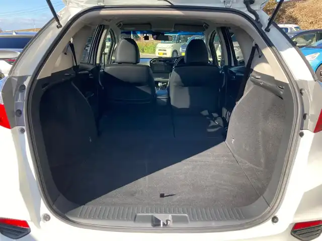 ホンダ シャトル ハイブリッド X 静岡県 2015(平27)年 8.6万km ホワイトオーキッドパール あんしんパッケージ/純正メモリーナビ/　AM FM CD DVD Bluetooth USB/ビルトインETC/前方ドライブレコーダー/LEDオートヘッドランプ/ハーフレザーシート/クルーズコントロール/純正15インチアルミホイール/スマートキー2本/パーキングアシスト/パドルシフト/フロントフォグランプ/シティブレーキアクティブシステム/フルセグTV/バックモニター