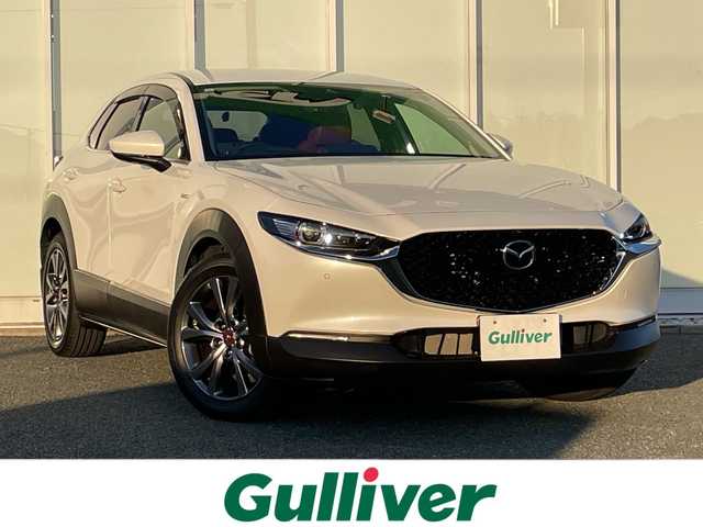 マツダ ＣＸ－３０ 20S 100周年特別記念車 福岡県 2021(令3)年 1.3万km スノーフレイクホワイトパールマイカ 純正ナビ(AM/FM/CD/DVD/BT/USB/HDMI)/アラウンドビューモニター/100周年記念モデル/・赤レザーシート/・赤フロアマット/・18インチ記念ホイール/純正前後ドライブレコーダー/ビルトインETC/社外レーダー探知機/レーダークルーズコントロール/アイドリングストップ/パワーバックドア/前後コーナーセンサー/前席シートヒーター/D席パワーシート/ステアリングヒーター/パドルシフト