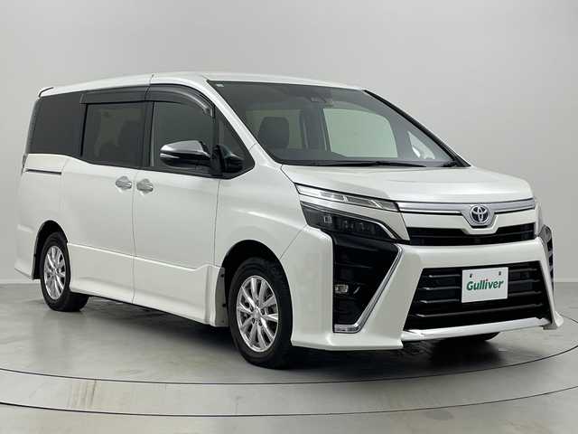 トヨタ ヴォクシー ハイブリッド ZS 煌Ⅲ 福島県 2020(令2)年 3.4万km ホワイトパールクリスタルシャイン /禁煙車//社外９型ナビ/CD・DVD・BT・MSV・フルセグTV//シートヒーター//両側パワースライドドア//前後ドライブレコーダー//トヨタセーフティセンス//クリアランスソナー//オートハイビーム//バックカメラ//クルーズコントロール//ＥＴＣ//ＬＥＤライト//革調シートカバー//ステアリングリモコン//純正アルミ付きサマータイヤ積込//取説・保証書