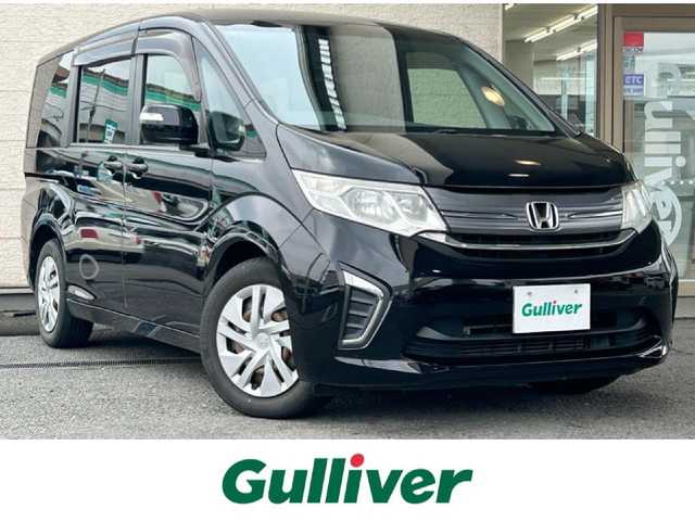 ホンダ ステップワゴン G 兵庫県 2015(平27)年 9万km クリスタルブラックパール 純正ナビ/純正フリップダウンモニター/(CD/DVD/BT/iPod/SD)/フルセグTV/バックカメラ/ETC/片側パワースライドドア/クルーズコントロール/黒革調シートカバー/電動格納ミラー/スマートキー/社外ドアバイザー/純正フロアマット