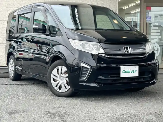 ホンダ ステップワゴン G 兵庫県 2015(平27)年 9万km クリスタルブラックパール 純正ナビ/純正フリップダウンモニター/(CD/DVD/BT/iPod/SD)/フルセグTV/バックカメラ/ETC/片側パワースライドドア/クルーズコントロール/黒革調シートカバー/電動格納ミラー/スマートキー/社外ドアバイザー/純正フロアマット