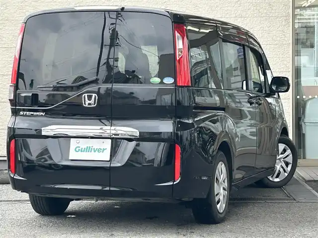 ホンダ ステップワゴン G 兵庫県 2015(平27)年 9万km クリスタルブラックパール 純正ナビ/純正フリップダウンモニター/(CD/DVD/BT/iPod/SD)/フルセグTV/バックカメラ/ETC/片側パワースライドドア/クルーズコントロール/黒革調シートカバー/電動格納ミラー/スマートキー/社外ドアバイザー/純正フロアマット