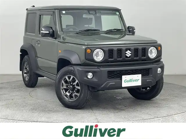 スズキ ジムニー シエラ JC 道央・札幌 2024(令6)年 0.4万km 緑 ・４WD/・寒冷地仕様/・社外メモリナビ/　BT／CD／DVD／SD／iPod／USB／フルセグ/・バックカメラ/・社外前方ドライブレコーダー/・純正ビルトインETC/・スズキセーフティサポート/・衝突軽減ブレーキ/・横滑り防止/・レーンキープアシスト/・ダウンヒルアシストコントロール/・前席シートヒーター/・純正サマー15インチAW/・純正フロアマット/・LEDヘッドライト/・オートライト/・プッシュスタート/・スマートキー/・スペアキー/・取扱説明書