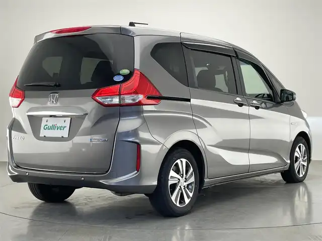 ホンダ フリード ハイブリット G ホンダセンシング 愛知県 2021(令3)年 5.5万km スーパープラチナグレーメタリック 社外８型ナビ　社外後席モニター　禁煙　黒ハーフレザー　ＨＤＭＩ　両側パワスラ　ＥＴＣ　シートヒーター　ホンダセンシング　衝突軽減　追従クルコン　フルセグＴＶ　カープレイ　ＤＶＤ　ＬＥＤオートライト