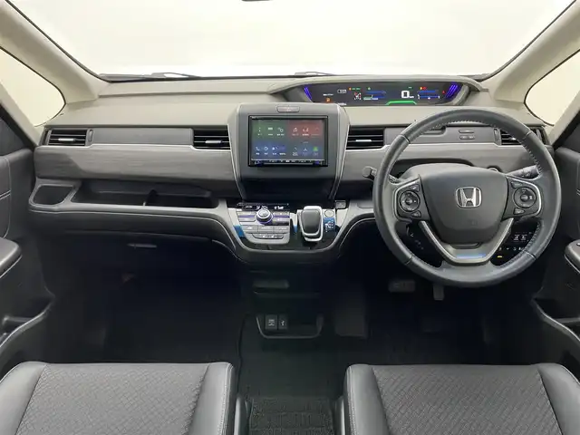 ホンダ フリード ハイブリット G ホンダセンシング 愛知県 2021(令3)年 5.5万km スーパープラチナグレーメタリック 社外８型ナビ　社外後席モニター　禁煙　黒ハーフレザー　ＨＤＭＩ　両側パワスラ　ＥＴＣ　シートヒーター　ホンダセンシング　衝突軽減　追従クルコン　フルセグＴＶ　カープレイ　ＤＶＤ　ＬＥＤオートライト