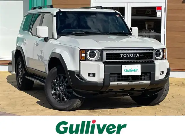 トヨタ ランドクルーザー ２５０ VX 宮崎県 2024(令6)年 1.2万km プラチナホワイトパールマイカ 純正12.3インチディスプレイオーディオ/（フルセグ/BT/HDMI/Miracast）/パノラミックビューモニター/デジタルインナーミラー/ETC2．0/サンルーフ/トヨタセーフティセンス/ブラインドスポットモニター/レーンキープアシスト/クリアランスソナー/レーダークルーズコントロール/前席シートヒーター/エアシート/運転席パワーシート/LEDヘットライト/フォグライト/純正18インチアルミホイール/プッシュエンジンスタート/スマートキー/フロアマット