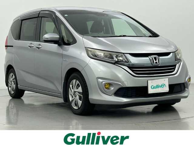 ホンダ フリード ハイブリット G ホンダセンシング 熊本県 2017(平29)年 10.9万km ルナシルバーM 純正ナビVXM-174VFi（ＣＤ・ＤＶＤ・フルセグ・ＢＴ・ＳＤ）/バックカメラ　/社外前後ドライブレコーダー　/ビルトインＥＴＣ　/両側パワースライドドア　/レーダークルーズコントロール　/衝突軽減ブレーキ　/レーンキープアシスト/横滑り防止/先行車発進お知らせ/車線逸脱警報/アイドリングストップ/純正フロアマット/オートライト/HIDライト/フォグライト/スマートキー/プッシュスタート/スペアキー1本/保証書