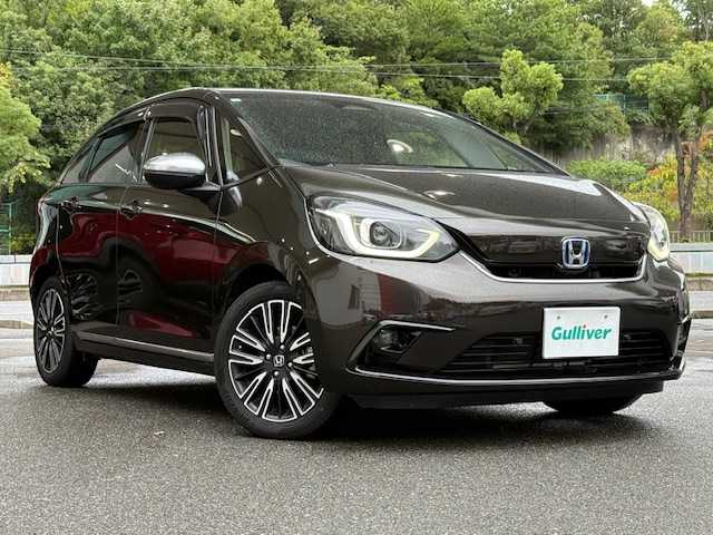 ホンダ フィット e:HEVリュクス 大阪府 2020(令2)年 6.5万km プレミアムグラマラスブロンズP /禁煙車//衝突被害軽減ブレーキ//純正8インチSDナビ/VXM-205VFEi//Bluetooth/CD/DVD/USB//フルセグテレビ//バックカメラ//前後純正ドライブレコーダー/DRH-204VD//前後コーナーセンサー//アダクティブクルーズコントロール//前席シートヒーター//16インチ純正アルミホイール//ドアバイザー//ETC//スペアキー×1