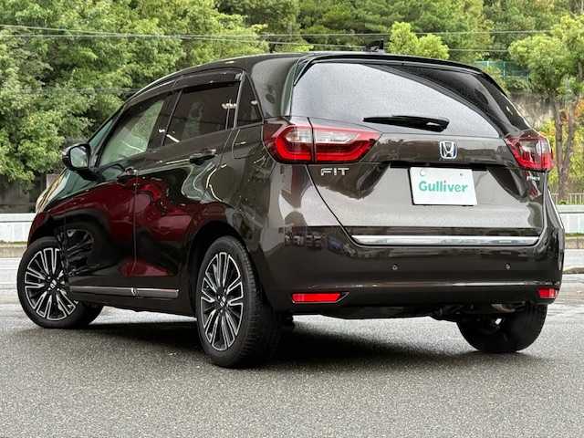 ホンダ フィット e:HEVリュクス 大阪府 2020(令2)年 6.5万km プレミアムグラマラスブロンズP /禁煙車//衝突被害軽減ブレーキ//純正8インチSDナビ/VXM-205VFEi//Bluetooth/CD/DVD/USB//フルセグテレビ//バックカメラ//前後純正ドライブレコーダー/DRH-204VD//前後コーナーセンサー//アダクティブクルーズコントロール//前席シートヒーター//16インチ純正アルミホイール//ドアバイザー//ETC//スペアキー×1
