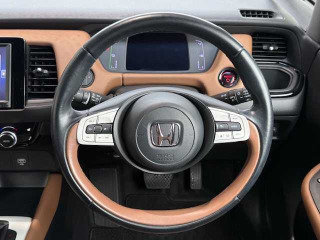ホンダ フィット e:HEVリュクス 大阪府 2020(令2)年 6.5万km プレミアムグラマラスブロンズP /禁煙車//衝突被害軽減ブレーキ//純正8インチSDナビ/VXM-205VFEi//Bluetooth/CD/DVD/USB//フルセグテレビ//バックカメラ//前後純正ドライブレコーダー/DRH-204VD//前後コーナーセンサー//アダクティブクルーズコントロール//前席シートヒーター//16インチ純正アルミホイール//ドアバイザー//ETC//スペアキー×1