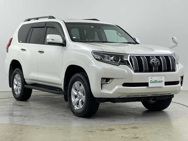 トヨタ ランドクルーザー プラド TX 道央・札幌 2022(令4)年 3.7万km ホワイトパールクリスタルシャイン ・４WD　/ ディーゼルターボ/・ムーンルーフ/7人乗り/・トヨタセーフティセンス/・プリクラッシュセーフティ/・レーダークルーズコントロール/・ケンウッド9インチ　ナビ/・DVD.CD.SD.BT.フルセグ/・HIDMI/バックカメラ」/・社外ドライブレコーダー/・ビルトインETC/・リア　ランゲージマット/・スマートキー