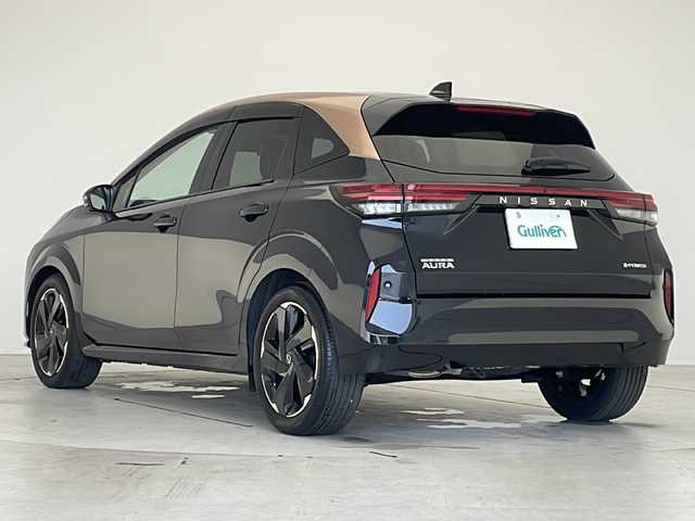 日産 オーラ G  90周年記念車 愛知県 2024(令6)年 1万km ミッドナイトブラック/サンライズカッパー プロパイロット/衝突被害軽減ブレーキ/BOSEプレミアムサウンド/純正8インチディスプレイオーディオナビ（あり）/全方位カメラ/レーダークルーズコントロール/シートヒーター/フルセグTV/Bluetooth/バックカメラ/コーナーセンサー/純正アルミホイール/ETC2.0/ブラインドスポットモニター/LEDヘッドライト/ステアリングヒーター/インテリジェントミラー/オートマチックハイビーム/置くだけ充電器/ステアリングスイッチ/スマートキー/プッシュスタート