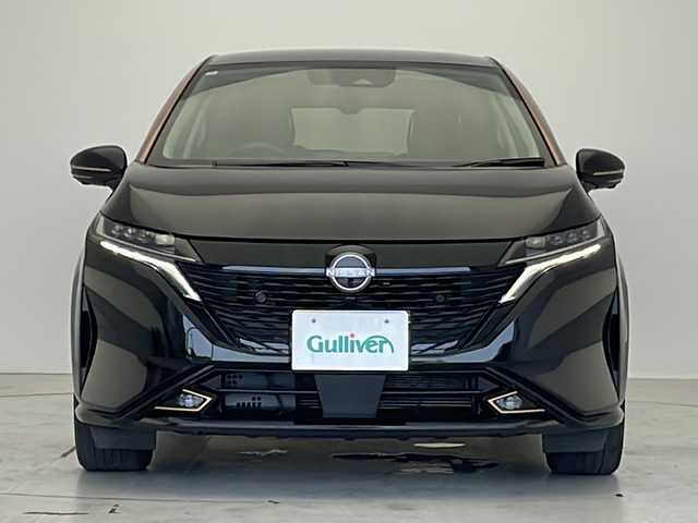 日産 オーラ G  90周年記念車 愛知県 2024(令6)年 1万km ミッドナイトブラック/サンライズカッパー プロパイロット/衝突被害軽減ブレーキ/BOSEプレミアムサウンド/純正8インチディスプレイオーディオナビ（あり）/全方位カメラ/レーダークルーズコントロール/シートヒーター/フルセグTV/Bluetooth/バックカメラ/コーナーセンサー/純正アルミホイール/ETC2.0/ブラインドスポットモニター/LEDヘッドライト/ステアリングヒーター/インテリジェントミラー/オートマチックハイビーム/置くだけ充電器/ステアリングスイッチ/スマートキー/プッシュスタート