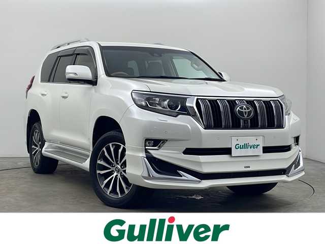 トヨタ ランドクルーザー プラド TX Lパッケージ 秋田県 2018(平30)年 2.8万km ホワイトパールクリスタルシャイン ４WD/純正ナビ【AM/FM/BT/CD/DVD】 /バックカメラ /フルセグTV/ETC2.0/ フロントモデリスタエアロ /サンルーフ /前席パワーシート /衝突被害軽減システム /フロントワイパーデアイサー /横滑り防止装置 /レーンキープアシスト/ヒルディセントコントロール/ダウンヒルアシストコントロール/スマートキー /プッシュスタート/オートエアコン/クリアランスソナー/クルーズコントロール/オートライト/ステアリングリモコン/電格ミラー/革巻きステアリング/ウィンカーミラー/純正フロアマット/ルーフレール/コーナーセンサー/フォグライト/保証書/取り扱い説明書
