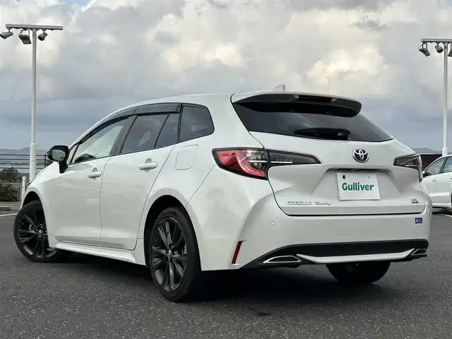 トヨタ カローラツーリング ハイブリッド ダブルバイビー 島根県 2021(令3)年 7万km ホワイトパールクリスタルシャイン 登録時走行距離　69594km/純正ナビ/Bluetooth/バックカメラ/レーダークルーズコントロール/電動パーキング/電動格納ミラー/コーナーセンサー/オートハイビーム/シートヒーター（DN席）/ステアリングヒーター/ステアリングスイッチ/スマートキー/スペアキー/レーントレーシングアシスト/プリクラッシュセーフティシステム/パーキングサポートブレーキ/ロードサインアシスト/純正フロアマット/ビルドインETC2.0/ドライブレコーダー前後/純正アルミ１７インチ