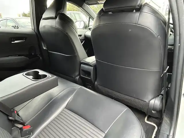 トヨタ カローラツーリング ハイブリッド ダブルバイビー 島根県 2021(令3)年 7万km ホワイトパールクリスタルシャイン 登録時走行距離　69594km/純正ナビ/Bluetooth/バックカメラ/レーダークルーズコントロール/電動パーキング/電動格納ミラー/コーナーセンサー/オートハイビーム/シートヒーター（DN席）/ステアリングヒーター/ステアリングスイッチ/スマートキー/スペアキー/レーントレーシングアシスト/プリクラッシュセーフティシステム/パーキングサポートブレーキ/ロードサインアシスト/純正フロアマット/ビルドインETC2.0/ドライブレコーダー前後/純正アルミ１７インチ