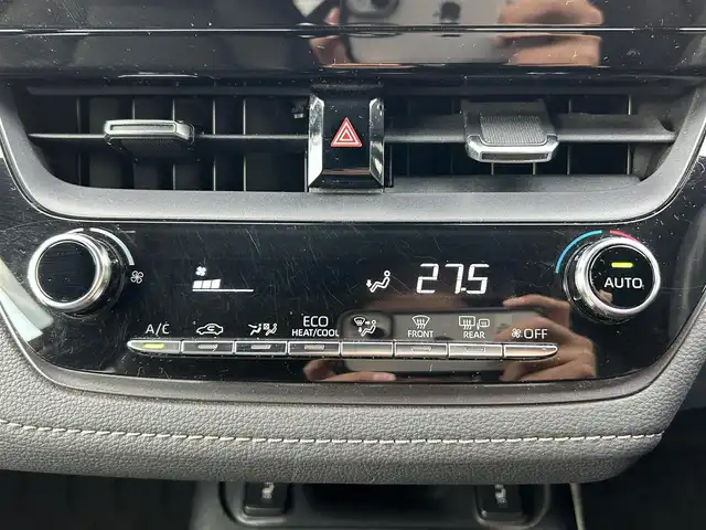 トヨタ カローラツーリング ハイブリッド ダブルバイビー 島根県 2021(令3)年 7万km ホワイトパールクリスタルシャイン 登録時走行距離　69594km/純正ナビ/Bluetooth/バックカメラ/レーダークルーズコントロール/電動パーキング/電動格納ミラー/コーナーセンサー/オートハイビーム/シートヒーター（DN席）/ステアリングヒーター/ステアリングスイッチ/スマートキー/スペアキー/レーントレーシングアシスト/プリクラッシュセーフティシステム/パーキングサポートブレーキ/ロードサインアシスト/純正フロアマット/ビルドインETC2.0/ドライブレコーダー前後/純正アルミ１７インチ